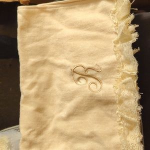 Soft cream color towels with lace and the letter r on it